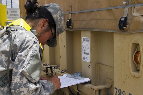 Pfc. Elle Y. Bailey, a transportation management coordinator with 613th Movement Control Team, 129th Combat Sustainment Support Battalion, 101st Sustainment Brigade, 101st Airborne Division (Air Assault), writes down the 3rd Brigade Combat Team, 101st Abn. Div.’s bumper number in order to keep accountability of the vehicles being staged at the marshaling area at Port Arthur, Tx., April 26, 2016. (Sgt. Neysa Canfield, 101st Airborne Division Sustainment Brigade Public Affairs)