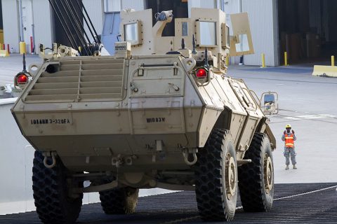 Pvt. Kenisha N. King, a transportion specialist with 372nd Inland Cargo Transfer Company, 129th Combat Sustainment Support Battalion, 101st Sustainment Brigade, 101st Airborne Division (Air Assault), ground guides the vehicle as it is unloaded from the USNS Benavidez at Port Arthur, Tx., April 25, 2016. (Sgt. Neysa Canfield, 101st Sustainment Brigade Public Affairs)