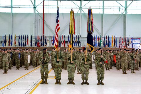 Guidon bearers stand with the American flag and the 2nd Brigade Combat Team, 101st Airborne Division unit colors during a traditional colors of the casing ceremony at ‘Hangar 3’, Apr. 27, 2016. This the fourth time the unit cases its colors for a deployment to Iraq. (Spc. Andres Alegria, 2nd Brigade Combat Team, 101st Airborne Division (Air Assault)) Guidon bearers stand with the American flag and the 2nd Brigade Combat Team, 101st Airborne Division unit colors during a traditional colors of the casing ceremony at ‘Hangar 3’, Apr. 27, 2016. This the fourth time the unit cases its colors for a deployment to Iraq. (Spc. Andres Alegria, 2nd Brigade Combat Team, 101st Airborne Division (Air Assault))
