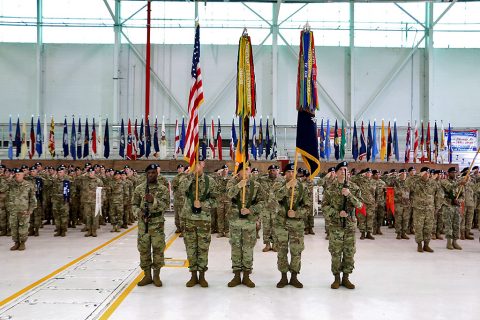 Guidon bearers stand with the American flag and the 2nd Brigade Combat Team, 101st Airborne Division unit colors during a traditional colors of the casing ceremony at ‘Hangar 3’, Apr. 27, 2016. This the fourth time the unit cases its colors for a deployment to Iraq. (Spc. Andres Alegria, 2nd Brigade Combat Team, 101st Airborne Division (Air Assault))