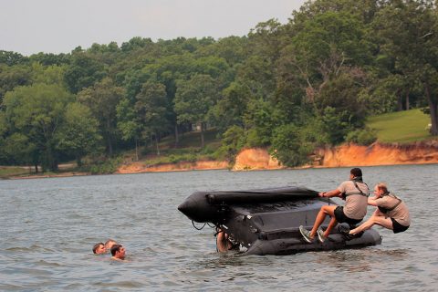 Soldiers with “Charlie Rock,” C Troop, 1st Squadron Regiment, 32nd Cavalry Regiment, 1st Brigade Combat Team, 101st Airborne Division (Air Assault) attempt to turn over a combat rubber raiding craft (CRRC), also known as the Zodiac during helocast training at Paris Landing State Park May 11, 2016. (Spc. Katie Petrosky, 5th Special Forces Group Public Affairs) Soldiers with “Charlie Rock,” C Troop, 1st Squadron Regiment, 32nd Cavalry Regiment, 1st Brigade Combat Team, 101st Airborne Division (Air Assault) attempt to turn over a combat rubber raiding craft (CRRC), also known as the Zodiac during helocast training at Paris Landing State Park May 11, 2016. (Spc. Katie Petrosky, 5th Special Forces Group Public Affairs)