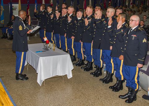 Command Sgt. Maj. Frank M. Graham Jr., command sergeant major for 101st Special Troops Battalion, 101st Airborne Division Sustainment Brigade, 101st Airborne Division (Air Assault), swears in the newly inducted noncommissioned officers to the NCO corps during the NCO Induction Ceremony at Wilson Theater on Fort Campbell, Ky., May 18, 2016. (Sgt. Neysa Canfield, 101st Sustainment Brigade, 101st Airborne Division (AA) Public Affairs)