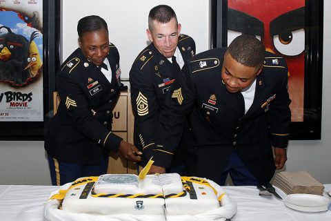  Sgt. Yemaya Webb, Command Sgt. Maj. Michael J. Perry, and Sgt. D’anthony Watkins cut the cake after the NCO Induction Ceremony at Wilson Theater on Fort Campbell, Ky., May 18, 2016. (Sgt. Neysa Canfield, 101st Sustainment Brigade, 101st Airborne Division (AA) Public Affairs)