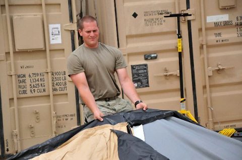 Pfc. Mark Herron, a Soldier in Headquarters and Headquarters Company, 39th Brigade Engineer Battalion, Task Force Strike, helps set up a tent May 18, 2016, at Life Support Area Strike in Erbil, Iraq. Task Force Strike, comprised of Soldiers from the 2nd Brigade Combat Team, 101st Airborne Division (Air Assault), is in Iraq as part of Combined Joint Forces Land Component Command – Operation Inherent Resolve, building partner capacity and advising and assisting Iraqi Security Forces.  (1st Lt. Daniel Johnson)