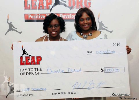 Danielle Dillard and her mom with Scholarship check