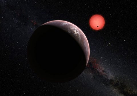 This artist’s impression shows an imagined view of the three planets orbiting an ultra-cool dwarf star just 40 light-years from Earth that were discovered using the TRAPPIST telescope at ESO’s La Silla Observatory. In this view, one of the inner planets is seen in transit across the disc of its tiny and dim parent star. (ESO/M. Kornmesser/N. Risinger (skysurvey.org))