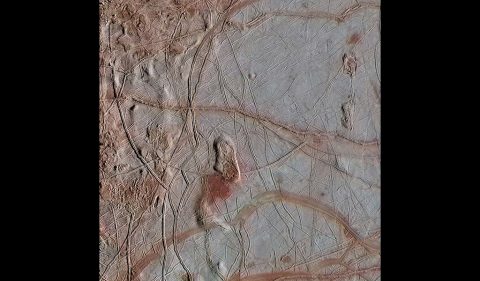 This enhanced-color view from NASA's Galileo spacecraft shows an intricate pattern of linear fractures on the icy surface of Jupiter's moon Europa. (NASA/JPL-Caltech/ SETI Institute) This enhanced-color view from NASA's Galileo spacecraft shows an intricate pattern of linear fractures on the icy surface of Jupiter's moon Europa. (NASA/JPL-Caltech/ SETI Institute)
