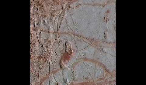 This enhanced-color view from NASA's Galileo spacecraft shows an intricate pattern of linear fractures on the icy surface of Jupiter's moon Europa. (NASA/JPL-Caltech/ SETI Institute)