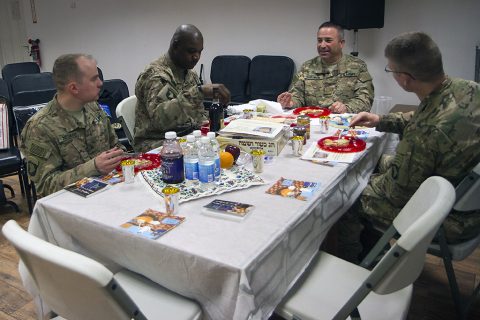 Sgt. Jason Nesman, the Combined Joint Force Land Component Command – Operation Inherent Resolve chaplain operations noncommissioned officer, Master Sgt. Fredrick D. Murphy, CJFLCC-OIR master chaplain assistant, Maj. Andrew Schulman, a rabbi with the 7th Mission Support Command, Kaiserslautern, Germany, and Lt. Col. David A. Bowlus, CJFLCC-OIR chaplain, celebrate a traditional Seder meal at the Baghdad Diplomatic Support Center in Baghdad April 30, 2016. (U.S. Army photo by Sgt. Katie Eggers)