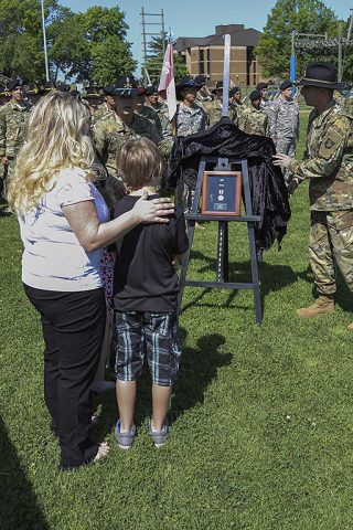 Lt. Col. Nathan Springer, commander of 1st Squadron, 32nd Cavalry Regiment, and Command Sgt. Maj. Ronald Newman, squadron command sergeant major, present the Ohio Military Medal of Distinction to the Martin family at the Bastogne Field May 13, 2016. The Martin family accepted the away on behalf of Staff Sgt. Jonathon Martin, a native of Bellevue, Ohio, who served with the “Bandit” squadron from 2005 until November 2007. (Sgt. Samantha Stoffregen, 1st Brigade Combat Team, 101st Airborne Division (Air Assault) Public Affairs)