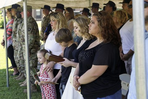 Family and friends pause during an award ceremony May 13, 2016 at Bastogne Field, to reflect on the actions and selfless service of Staff Sgt. Jonathon Martin, who was killed in action November 2007 while serving with 1st Squadron, 32nd Cavalry Regiment, 1st Brigade Combat Team, 101st Airborne Division (Air Assault). His family was presented the Ohio Military Medal of Distinction by the command team of the “Bandit” Squadron. (Sgt. Samantha Stoffregen, 1st Brigade Combat Team, 101st Airborne Division (Air Assault) Public Affairs)