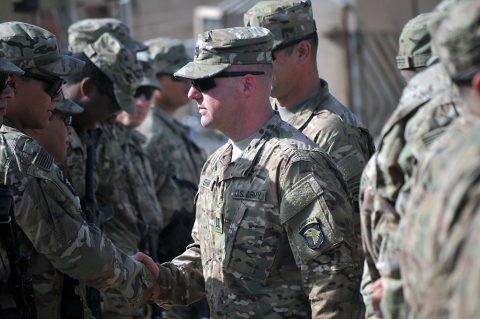 Cpt. Justin Shaw, center, commander of Company D, 1st Battalion, 26th Infantry Regiment, Task Force Strike, shakes the hands of Soldiers of Company D after their patching ceremony June 3, 2016, in Taji, Iraq. Soldiers are allowed to wear the patch for the rest of their careers, signifying service in a theater of combat operations with the 101st Airborne Division (Air Assault). (1st Lt. Daniel Johnson) Cpt. Justin Shaw, center, commander of Company D, 1st Battalion, 26th Infantry Regiment, Task Force Strike, shakes the hands of Soldiers of Company D after their patching ceremony June 3, 2016, in Taji, Iraq. Soldiers are allowed to wear the patch for the rest of their careers, signifying service in a theater of combat operations with the 101st Airborne Division (Air Assault). (1st Lt. Daniel Johnson)