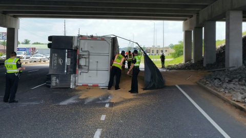 A Semi Truck hauling Grain overturned today on Fort Campbell Boulevard under the 101st Parkway overpass.