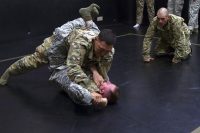 Sergeant Stewart J. Thomas, a multichannel transmission systems operator with 58th Signal Company, 101st Special Troops Battalion, 101st Airborne Division Sustainment Brigade, 101st Airborne Division, pins down his opponent May 19 during a combatives tournament which was part the Best Spartan competition. (Sgt. Neysa Canfield, 101st Airborne Division Sustainment Brigade Public Affairs)