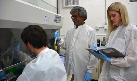 Kasthuri "Venkat" Venkateswaran, senior research scientist at JPL, center, works with engineer Ryan Hendrickson, left, and intern Courtney Carlson, right. (NASA/JPL-Caltech)