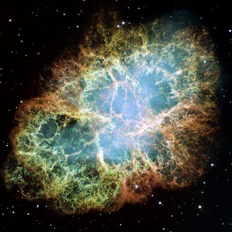 The best-known wind nebula is the Crab Nebula, located about 6,500 light-years away in the constellation Taurus. At the center is a rapidly spinning neutron star that accelerates charged particles like electrons to nearly the speed of light. As they whirl around magnetic field lines, the particles emit a bluish glow. This image is a composite of Hubble observations taken in late 1999 and early 2000. The Crab Nebula spans about 11 light-years. (NASA, ESA, J. Hester and A. Loll (Arizona State University))