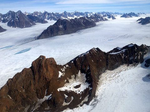 Upper part of Midgard Glacier system in southeast Greenland. Photo taken during NASA's Operation IceBridge Helheim-Kangerdlugssuap Gap B mission on May 17, 2016. (NASA/Maria-José Viñas)