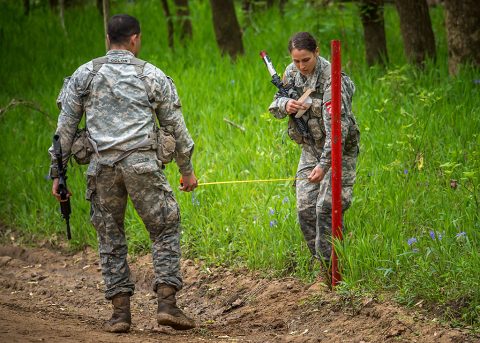 (left) 1st Lt. Edward Colon and (right) 2nd Lt. Leah Mullenix, Team 23, 326th Brigade Engineer Battalion, 1st Brigade Combat Team, 101st Airborne Division (Air Assault), complete an engineering skill’s test during day two of the Best Sapper Competition at Fort Leonardwood, Mo., April 20, 2016. The competition is described as “50 teams, 50 miles, and 50 hours” of all-encompassing engineering tasks from tactical obstacle planning, road crater emplacement, and urban breaching. (U.S. Army photo courtesy of Fort Leonardwood Public Affairs)