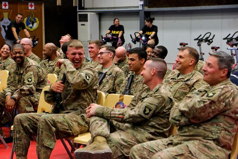 Combined Joint Forces Land Component Command – Operation Inherent Resolve service members laugh at jokes during the Star Spangled Comedy Tour at the Eagle Fitness Center, Forward Operating Base Union III, Baghdad, June 21, 2016. The tour, organized by Armed Forces Entertainment, featured comedians Stephen Thomas, Sam Fedele and Steve Mazan (not pictured), who performed in Iraq for four days. Other shows were performed in Erbil, Camp Taji and at the Baghdad Diplomatic Support Center. (Sgt. Katie Eggers)