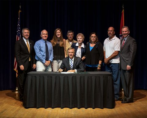 Bill Signing Ceremony 0 (L to R) Senator Kerry Roberts, Father, Chuck Head, Sister, Abbey Head, Grandfather, Ed Lutrell, Grandmother, Emma Lutrell, Mother, Gina Head-Heiber, Step-father, Steven Heiber and State Representative Joe Pitts. (Center) Governor Bill Haslam.