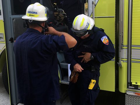 Ashland City fire rescue personnel get their gear on and prepare to participate in a confined space rescue training exercise at the Cheatham Dam Powerhouse in Charlotte, Tennessee, May 24, 2016. (USACE photo by Josh Lowery) 