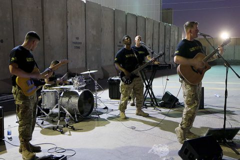 “Cover Down,” an element from the 101st Airborne Division (Air Assault) Band, perform for Soldiers outside the Eagle Fitness Center on Forward Operating Base Union III, Baghdad, July 2, 2016. The group performed popular songs for Combined Joint Forces Land Component Command – Operation Inherent Resolve service members during a day of activities celebrating the Fourth of July. (U.S. Army photo by Sgt. Katie Eggers/Released)