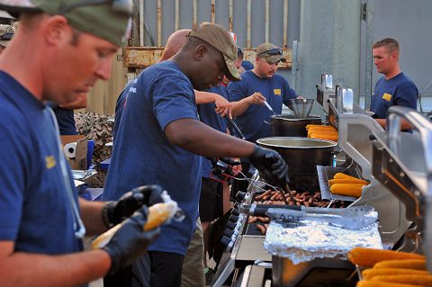 Volunteers from across the Combined Joint Forces Land Component Command -- Operation Inherent Resolve, prepare food in support of the Independence Day celebration sponsored by the USO, held at the former Erbil International Airport, Erbil Iraq, July 4, 2016. The event was held for all U.S. and Coalition service members in Erbil and included a variety of food and drink, games, and live music provided by the 101st Airborne Division (Air Assault) group, The Other Guys, and a raffle sponsored by the USO and other organizations. (U.S. Army Photo by Maj. Allen Hill/Released) 