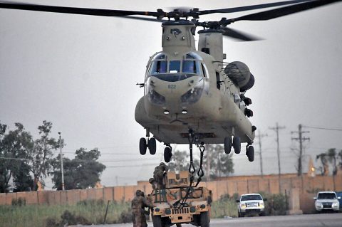 A hook-up team, consisting of Soldiers with 1st Battalion, 502nd Infantry Regiment, Task Force Strike, attach an M1151 Humvee to a CH-47 Chinook helicopter during a sling load training exercise July 16 2016, in Taji, Iraq. (1st Lt. Daniel Johnson) A hook-up team, consisting of Soldiers with 1st Battalion, 502nd Infantry Regiment, Task Force Strike, attach an M1151 Humvee to a CH-47 Chinook helicopter during a sling load training exercise July 16 2016, in Taji, Iraq. (1st Lt. Daniel Johnson)
