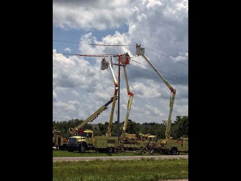 CDE crews working on a pole.