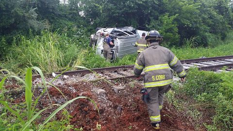 EMS works a rollover accident on Jack Miller Boulevard.