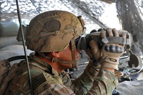 Sgt. Arturro Hernandez of Apache Troop, 1st Squadron, 75th Cavalry Regiment, Task Force Strike, looks through his binoculars during his guard shift June 18th, 2016, at Kara Soar Base, Iraq. Part of Troop A’s mission is protecting the artillery responsible for the fires at the Kara Soar Base. The fires at the Kara Soar Base serve two roles: force protection for Coalition and Iraqi security forces and fire in support of maneuver, enabling ISF to defeat Daesh. (1st Lt. Daniel Johnson)