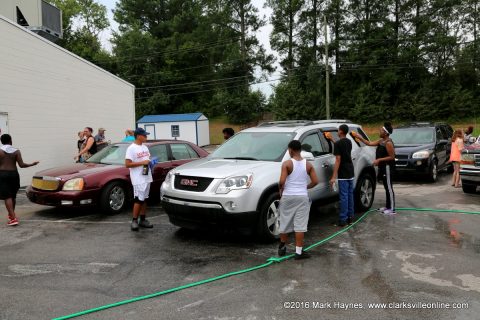 LEAP Youth working hard at their Car Wash Friday.