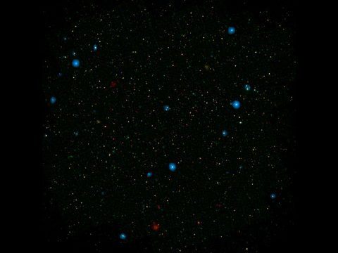 The blue dots in this field of galaxies, known as the COSMOS field, show galaxies that contain supermassive black holes emitting high-energy X-rays. (NASA/JPL-Caltech) The blue dots in this field of galaxies, known as the COSMOS field, show galaxies that contain supermassive black holes emitting high-energy X-rays. (NASA/JPL-Caltech)