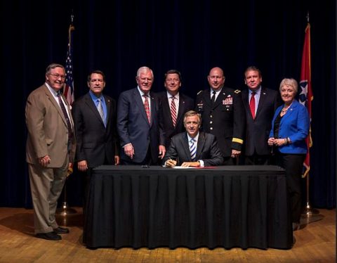 Governor Bill Haslam signs the National Guard Force Protection Act of 2016 on June 10th in a ceremony at the War Memorial Building in Nashville. Pictured from left are: Rep. John Ragan, Sen. Mark Green, Rep. Charles Sargent, Leader Mark Norris, Gov. Haslam, Maj. Gen. Max Haston, Leader Gerald McCormick and Sen. Janice Bowling. 