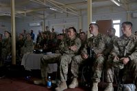 Combined Joint Forces Land Component Command – Operation Inherent Resolve service members watch the movie “Range 15” at Forward Operating Base Union III, Baghdad, July 10, 2016. After the movie, service members had a meet and greet with stars of the movie, Mat Best, CEO of Article 15 Clothing and Army Ranger veteran, Nick Palmisciano, founder of Ranger Up clothing company and Army veteran, and Jarred Taylor, Article 15’s chief marketing officer and Air Force veteran. (U.S. Army photo by Sgt. Katie Eggers)