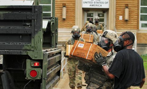 Soldiers with Echo Forward Support Company, 326th Brigade Engineer Battalion, 1st Brigade Combat Team, 101st Airborne Division, Fort Campbell, Kentucky, conduct a simulated supply pickup operation during a Chemical, Biological, Radiological and Nuclear defense training exercise at Muscatatuck Urban Training Center, Indiana, Aug. 14, 2016. Company E leaders used the exercise to introduce their Soldiers to a new piece of equipment, the M50 – Joint Service General Purpose Mask, which replaced the US Military’s M40 Field Protective Mask. (Sgt. Quentin Johnson, 211th MPAD) 