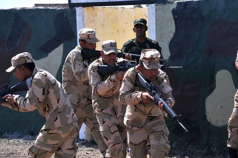 A team of Iraqi army ranger students conducts a glass house room clearing drill as their leadership watches at Camp Taji, Iraq, July 18, 2016. This drill, conducted within a diagram or outline of a building, allows the students to practice room clearing techniques while in full view of their trainers. Camp Taji is one of four Combined Joint Task Force – Operation Inherent Resolve build partner capacity locations dedicated to training Iraqi security forces. (U.S. Army photo by 1st Lt. Daniel Johnson/Released) 