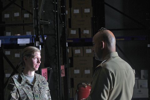 Capt. Shige Clark with Headquarters and Headquarters Company, 526th Brigade Support Battalion, speaks to her Iraqi counterpart about the layout and procedures of a medical supply storage facility July 12, 2016, in Taji, Iraq. The 5256th BSB and other coalition forces on Camp Taji are advising the Iraqi security forces on logistics programs and procedures. (1st Lt. Daniel Johnson/Released)