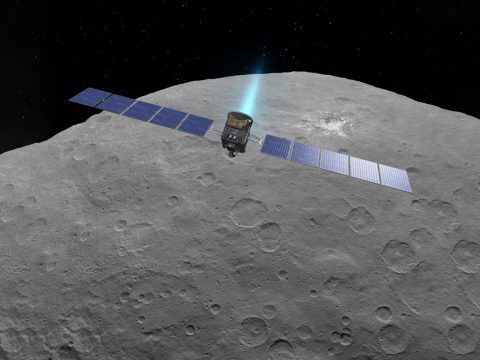 This artist concept shows NASA's Dawn spacecraft above dwarf planet Ceres, as seen in images from the mission. (NASA/JPL-Caltech)