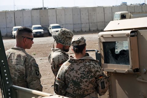 1st Sgt. John Wilkerson, left, the senior noncommissioned officer for Headquarters and Headquarters Company, 2nd Battalion, 502nd Infantry Regiment, Task Force Strike, works with members of the German contingent on a Humvee , in Erbil, Iraq, June 22, 2016. U.S. and German soldiers from Combined Joint Land Forces Component Command - Operation Inherent Resolve assisted in teaching a driver’s training class to Peshmerga forces. (1st Lt. Daniel Johnson/Released) 