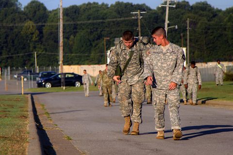 Pvt. Trevor L. Arbuckle (right), a small arms and artillery repairer with 584th Support Maintenance Company, 129th Combat Sustainment Support Battalion, 101st Airborne Division (Air Assault) Sustainment Brigade, 101st Abn. Div., helps motivate his partner during the last half mile of a four-mile ruck march, Sept. 20, 2016, during the Burden Bearer Challenge on Fort Campbell, Ky. (Sgt. Neysa Canfield/101st Airborne Division Sustainment Brigade Public Affairs) 