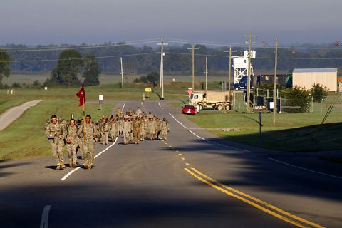 Sgt. Phillip V. Breton, a wheeled vehicle mechanic with 584th Support Maintenance Company, 129th Combat Sustainment Support Battalion, 101st Airborne Division (Air Assault) Sustainment Brigade, 101st Abn. Div., carries the company guidon during the last mile of a four-mile ruck march, Sept. 20, 2016, during the Burden Bearer Challenge on Fort Campbell, Ky. (Sgt. Neysa Canfield/101st Airborne Division Sustainment Brigade Public Affairs) 