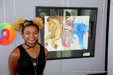 Brianah Summons won 1st place in the High School Art Show with her painting of animals.