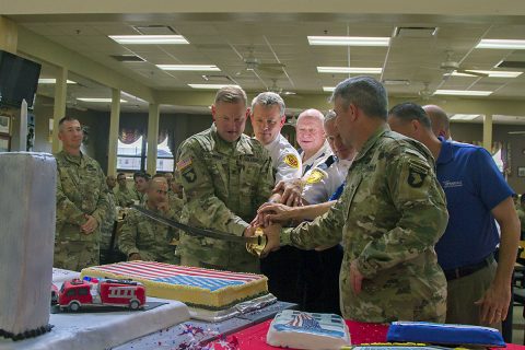 Col. Stanley Sliwinski, commander of the 101st Airborne Division Sustainment Brigade, 101st Abn. Div. (Air Assault), Brig. Gen. Scott Brower, acting senior commander for the 101st Abn. Div. (Air Assault), and representatives from the police and fire departments from Oak Grove, Ky., and Hopkinsville, Ky., cut a memorial cake at the 101st Abn. Div. Sust. Bde. dining facility on Fort Campbell, Ky., Sept. 9, 2016, during the Sept. 11, 2001 memorial luncheon. (Sgt. Neysa Canfield/101st Airborne Division Sustainment Brigade Public Affairs) 