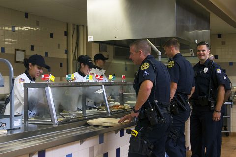 Police officers from Oak Grove, Ky., and Hopkinsville, Ky., police departments stand in line to receive their food at the 101st Airborne Division Sustainment Brigade, 101st Abn. Div. (Air Assault), dining facility on Fort Campbell, Ky., Sept. 9, 2016, during the Sept. 11, 2001 memorial luncheon. (Sgt. Neysa Canfield/101st Airborne Division Sustainment Brigade Public Affairs) 