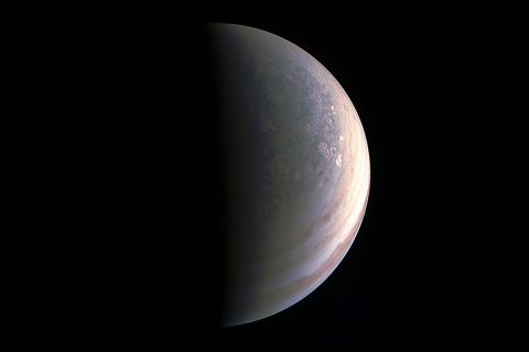 NASA's Juno spacecraft captured this view as it closed in on Jupiter's north pole, about two hours before closest approach on Aug. 27, 2016. Image (NASA/JPL-Caltech/SwRI/MSSS)