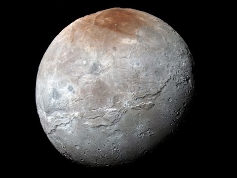 NASA's New Horizons spacecraft captured this high-resolution, enhanced color view of Pluto’s largest moon, Charon, just before closest approach on July 14, 2015. The image combines blue, red and infrared images taken by the spacecraft's Ralph/Multispectral Visual Imaging Camera (MVIC); the colors are processed to best highlight the variation of surface properties across Charon. (NASA/JHUAPL/SwRI)