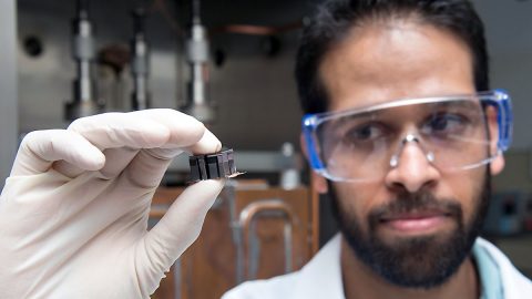 Samad Firdosy, a materials engineer at JPL, holds a thermoelectric module made of four thermocouples, which are devices that help turn heat into electricity. Thermocouples are used in household heating applications, as well as power systems for spacecraft. (NASA/JPL-Caltech)