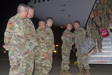 Lt. Col. James C. Reese, commander of 2nd Battalion, 44th Air Defense Artillery Regiment, 101st Airborne Division (Air Assault) Sustainment Brigade, 101st Abn. Div., is greeted by Command Sgt. Maj. Gabriel Espinosa, acting senior command sergeant major for the 101st Abn. Div., and command teams from 108th Air Defense Artillery Brigade out of Fort Bragg, N.C., and 101st Abn. Div. Sust. Bde., Nov. 5, 2016, as he arrives to Fort Campbell, Ky. (Sgt. Neysa Canfield/101st Airborne Division Sustainment Brigade Public Affairs) 