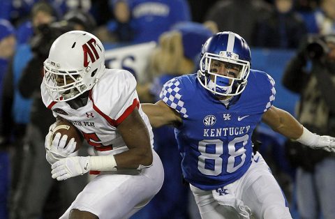 Austin Peay Governors wide receiver Kentel Williams (5) runs the ball against Kentucky Wildcats wide receiver Charles Walker (88) in the first half at Commonwealth Stadium. (Mark Zerof-USA TODAY Sports)